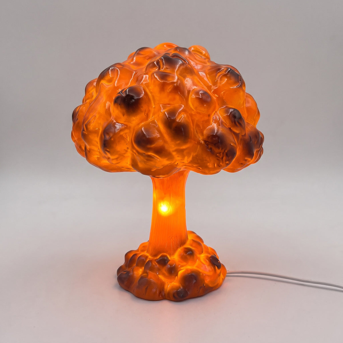 Svampmoln LED-bordslampa i glansig orange resin, tänd